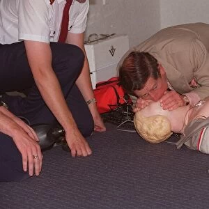 Prince Charles getting up close and personal with a resussitation dummy at