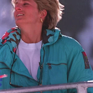 PRINCESS OF WALES WEARING GREEN SKI SUIT SEATED ON SKI CHAIR DURING SKIING HOLIDAY IN