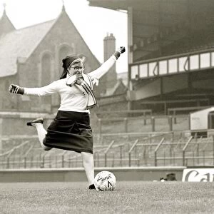 Soccer Sister - Nun kicking football shooting at goal Goodison Park Everton