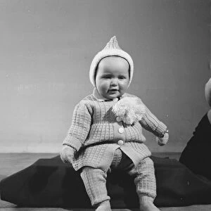 Unknown child model seen here modelling one of the years Reveille knitwear outfits