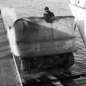 Valentine DD Swimming tanks leave the ramp of a landing craft