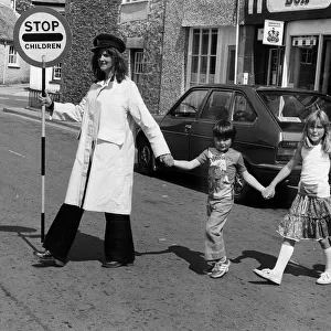 Viva Hamnel with children crossing the road 1978 in Callington Cornwall also sings