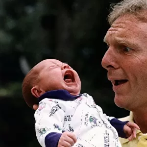 Former West Ham and England footballer Bobby Moore with his first grandchild Poppy