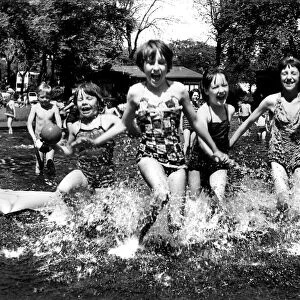 Youngsters enjoy a hot summer day in the water in 1963 at Brandling Park, Newcastle