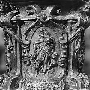 Charity, particular of the bronze candelabrum of Annibale Fontana, Certosa of Pavia