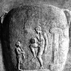 Detail of a funerary stela representing a child and a naked man holding a sphere in balance. National Archaeological Museum, Athens