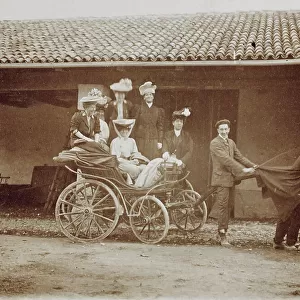 Group of women on board a carriage pulled by men