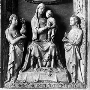 Madonna with Child and two angels. Sculpture by Giovanni d'Agostino found at the Saint Bernardino Oratory in Siena