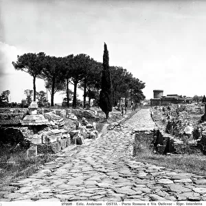 Via Ostiense in Ancient Ostia. In the background, Porta Romana