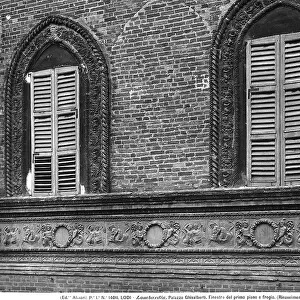 Particular of the frieze and the windows of the Modegnani-Ghisalberti Palace in Lodi