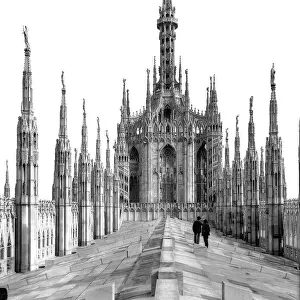 The roof of the central nave of the Cathedral of Milan with pinnacles and the statue of the "Madonnina"