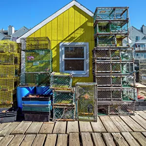 Maine, Portland, Colorful shack and lobster traps at the Widgery wharf