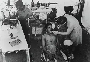 Surgery Prints: A dentist at work in a make-shift surgery, Burma, 1944 circa (b/w photo)