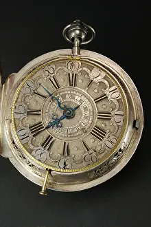Roman Numeral Prints: Dial of embossed silver carriage clock