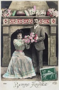 Studios Tiffany Prints: French postcard dated circa, 1900, showing romantic couple sharing flowers