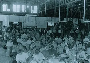 Packing Prints: Groups showing a few of the workers stringing beans in the J