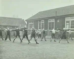 Stretching Prints: Hackney Marsh Playing Fields: exercise in yard, London, 1937 (b/w photo)