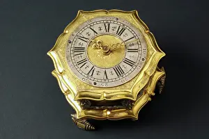 Roman Numeral Prints: Hexagonal-shaped horizontal table clock inserted in glass and brass case