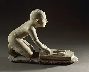 Dough Prints: Limestone statue of baker at work