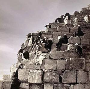 Mid-19th century tourists climbing the Great Pyramid of Giza with the aid of local guides Mid-19th century tourists climbing the Great Pyramid of Giza with the aid of local guides