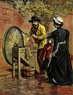 Grinding Prints: A scissors grinder sharpening scissors