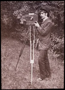 Self portrait with camera, tripod and pistol, 1886 (lantern slide) Self portrait with camera, tripod and pistol, 1886 (lantern slide)