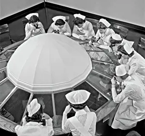 Studying Prints: Student nurses observing an operation