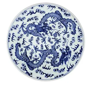 White and blue plate with two four-clawed dragons and stylized flames and clouds White and blue plate with two four-clawed dragons and stylized flames and clouds