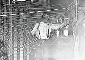 Newton Prints: A wrapper working at his machine, 1908